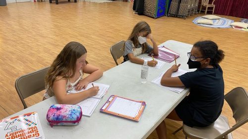Kids at a table doing homework Our staff is there to help students stay on track! Whether it's through creative activities during breaks or the supportive presence of loving staff, students are encouraged to explore their individuality and develop a love for learning.