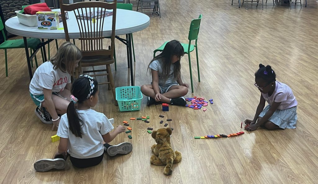 Kids on the floor playing games Unleashing creativity and FUN! Students engage in a variety of activities, from outdoor fun, board games and art projects to imaginative play and simply hanging out with friends, letting imaginations run wild--allowing them to just be kids!